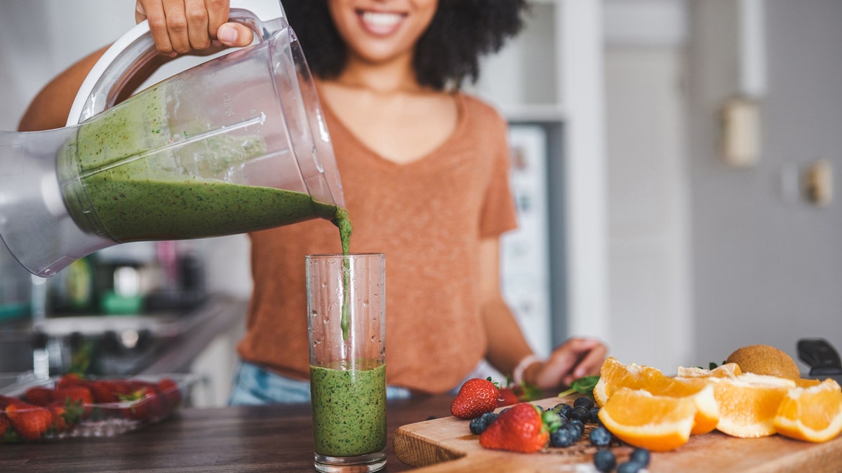 Woman that poured smoothie