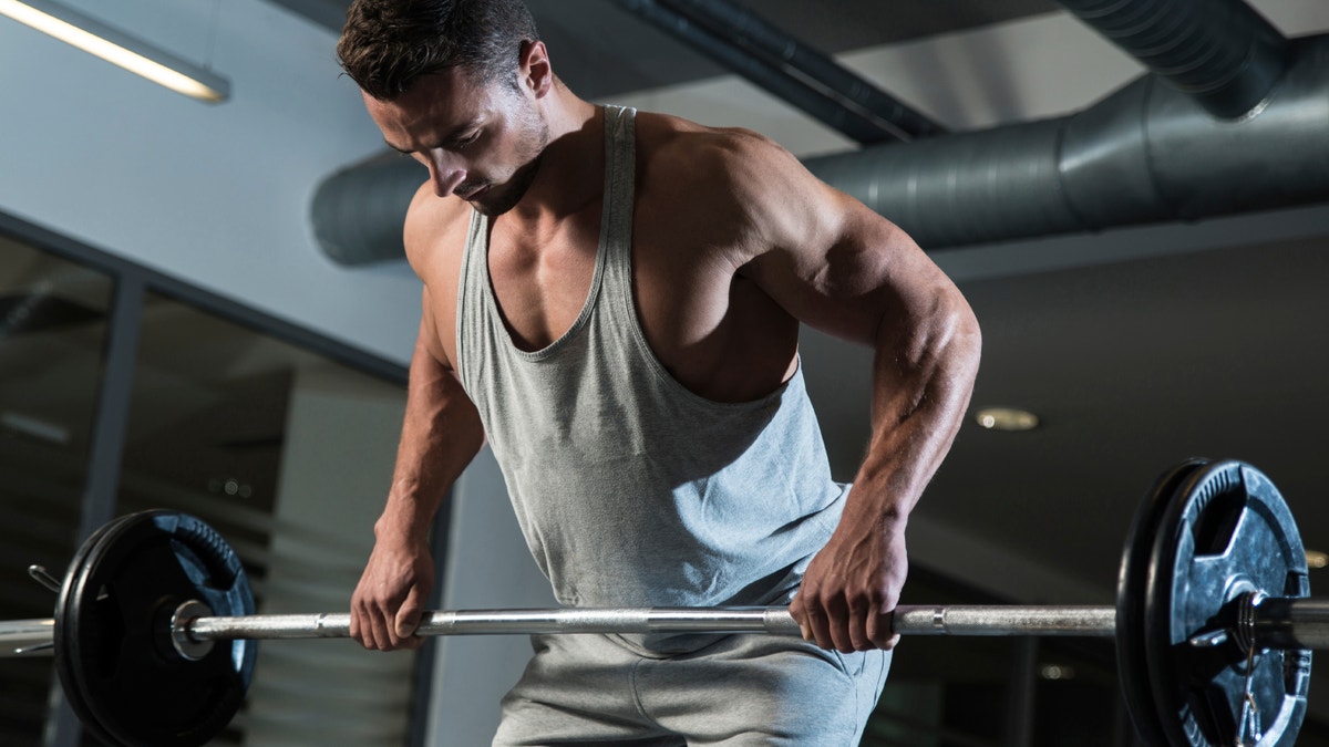 Man raising weights